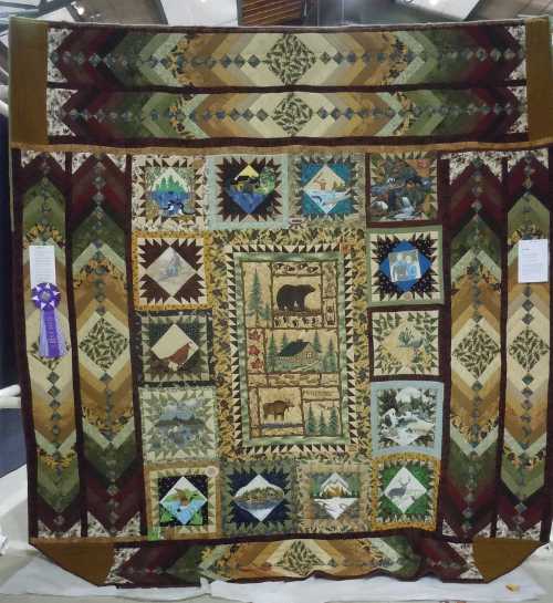 VIP Judge Rich Hinchcliff gravitated to Sandi Folmar’s outdoor themed-quilt at the Falling Leaves Quilt Show, which took place Saturday, October 5, and Sunday, October 6, 2013, in Lakeport, Calif. Photo by Connie Cracraft photo. 2012quiltshowfolmar
