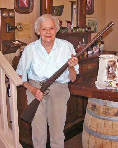 The double barrel, black powder shotgun pictured here was carried across the plains by Robert Henderson as he traveled to Lake County with a wagon train. The 1850's William Moore & Company gun was recently donated to the Ely Stage Stop Museum by Robert's great-grand daughter, Carolyn Henderson-Rohner, who is holding the gun. Photo courtesy of Dr. John Parker. roberthendersongun