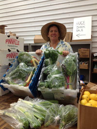 Lake Co-op producer Bibiana Love of Ron & Bibiana Love Farms display products sold through the Co-op in September 2013. Photo courtesy of the Lake Co-op. bibianalove